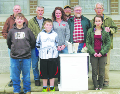 Front row, from left, Scholarship winners Joshua Burns, Chase Thompson, and LaRanda Piatt; Back row, from left, Terry Robinson, mentor, Buck Williams, mentor, Emilee Arthur, President Adams County Farm Bureau, Bill Wickerham, Adams SWCD District Mgr./Adams Co Apiary Inspector, Kenny Moles, Adams County Beekeepers Association President, and Andrew Frowine, mentor.